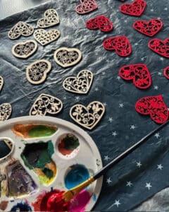 hand painting heart shaped wooden decorations